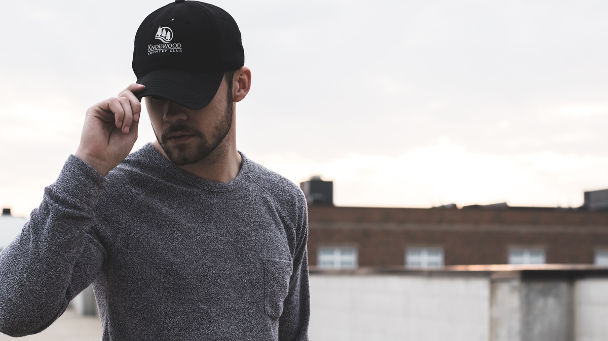 Men's Black Baseball Cap and Gray Long-sleeved Shirt